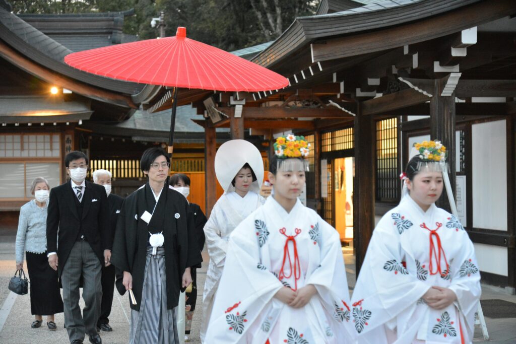 Japanese Shinto wedding procession with traditional attire at a shrine in Nara, Japan.