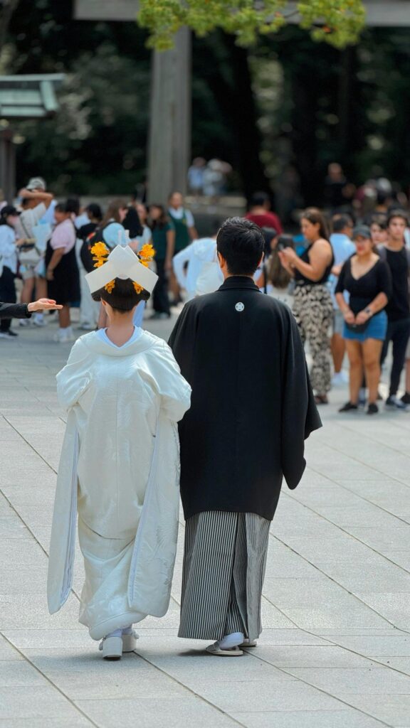 pexels-photo-31318776-31318776 A couple in traditional attire during a wedding ceremony in Shinjuku City, Tokyo, Japan.