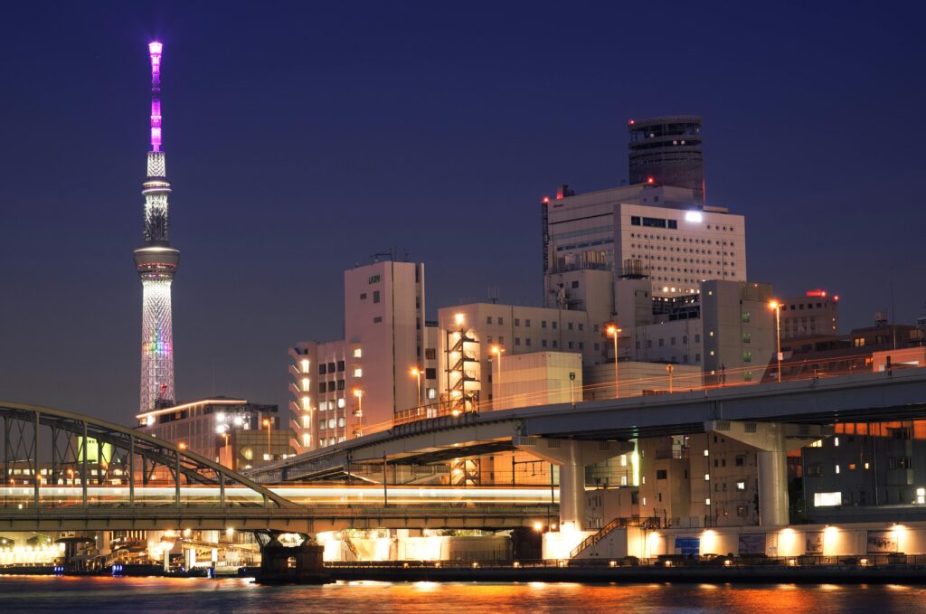 pexels-photo-8508388-8508388 Stunning skyline of Sumida City, Tokyo, featuring the illuminated Tokyo Skytree and vibrant urban landscape at night.